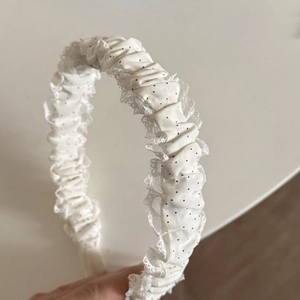 Chic blue and white polka dot lace headband with ruffled fabric and vintage bow design