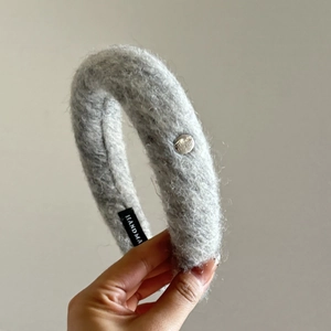 Thick grey faux fur headband with handmade label and silver metal button detail