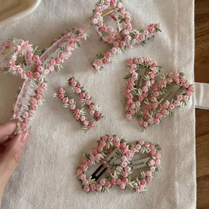 Pink sunset floral embroidery hair clip set featuring sweet flower patterns on canvas