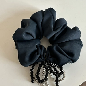 Elegant Prussian blue fabric scrunchie with dangling black and silver bead ornaments