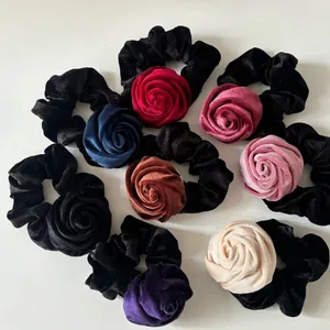 Eight-piece velvet rose hair scrunchies set in various colors on white background