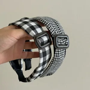 Retro black and white checkered headband with vintage leather buckle detail for women