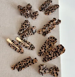 Detail of French leopard print hair clips and tortoise shell accessories set