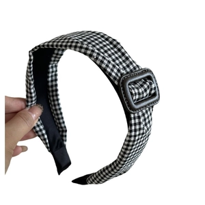 Vintage checkered headband with a stylish brown square buckle on a classic grid pattern