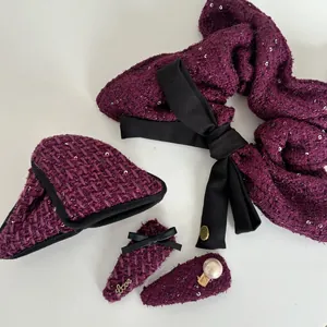 Detailed set of purple tweed hair accessories with satin bows and pearl decorations