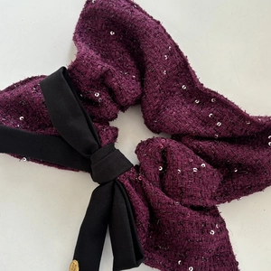 Purple tweed scrunchie with silver sequins, large black bow and gold brand charm