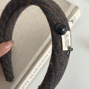 Retro autumn winter padded headband in navy blue herringbone wool with bow charm