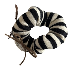 Striped knit scrunchie with a brown bow and bear charm on a clean white background
