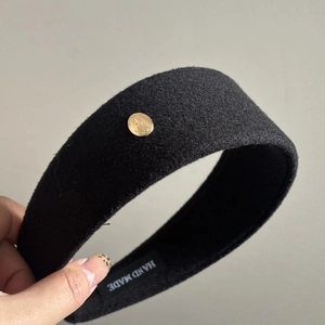Thick black wool felt headband with gold 'Believe' plaque for high cranial top look