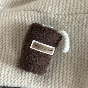Cute coffee cup plush hair clip with iced coffee leather tag and soft brown texture