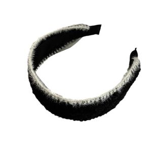 Elegant black and white contrast knitted headband with soft white faux fur trim