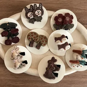Handmade knitted hair clips set featuring cute rabbit, fox, flower and cherry designs