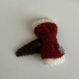 Red and white plush snowflake bow hair clip with faux lamb wool for festive winter look