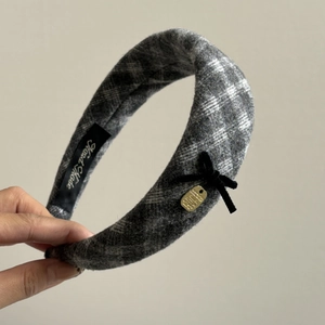 Elegant plaid tweed headband with black velvet bow and gold pendant detail