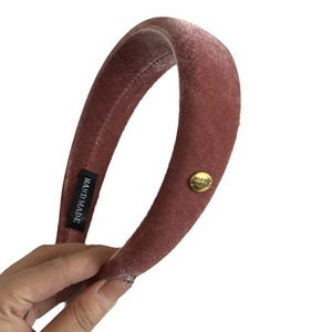 Pink velvet padded headband with gold-tone buckle and soft velvet texture for women