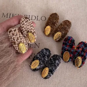 French tweed hair clips with golden oval buckles for women in four different vintage colors