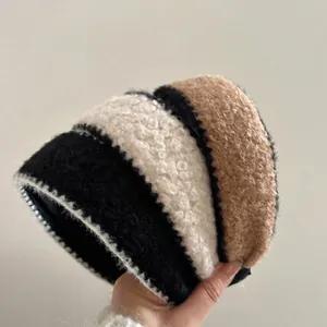 Plush faux lamb wool bucket hat with black beige and khaki color block stripes
