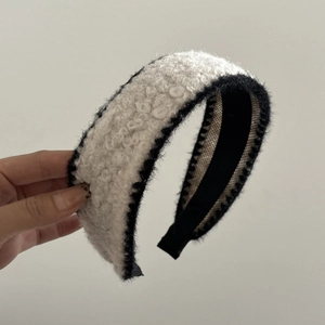 Wide plush headband with contrast black and white faux shearling fur for women