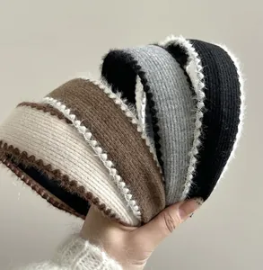 Detailed close-up of knit plush headbands in four colors with scalloped lace edge