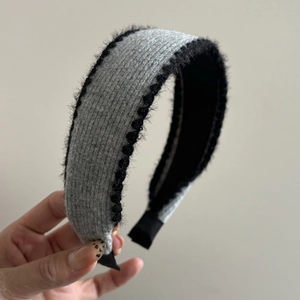 Grey knitted headband with black faux fur trim and contrast plush edges for women