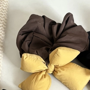 Padded bow scrunchie for women featuring a coffee brown and ginger yellow color-block design