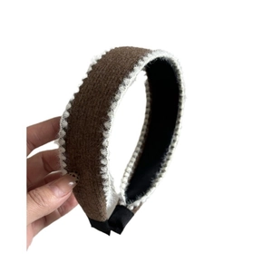 Elegant wide brown plush headband with white wavy trim for a stylish high skull top look