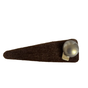 Vintage caramel brown fabric hair clip with a pearl accent and lucky metal charm