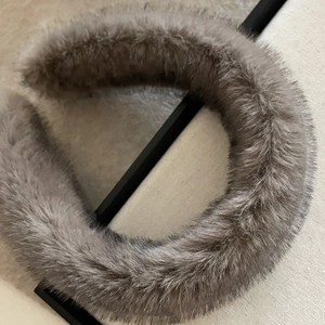 Thick grey plush wide headband made of soft faux fur for versatile winter hair styling