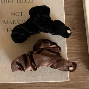 Large velvet bow hair claws in black and coffee brown with elegant gold accents