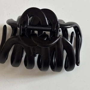 Large matte black pumpkin hair claw clip with double C design for thick hair