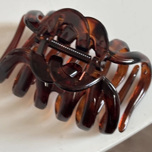 Large tortoiseshell hair claw clip with interlocking design for thick hair styling