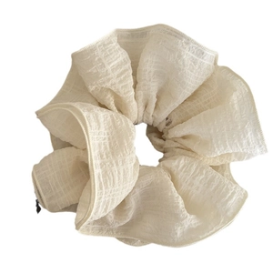 Elegant oversized cream layered bubble ruffle scrunchie hair tie with textured fabric