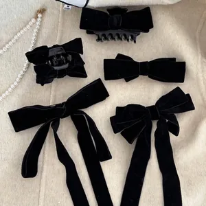 Five-piece set of black velvet bow hair clips including spring clips and hair claws
