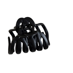 Large black matte shark hair claw clip with cutout design for thick hair styling