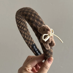 Brown plaid headband featuring a cute plush bear with bow and handmade woven label