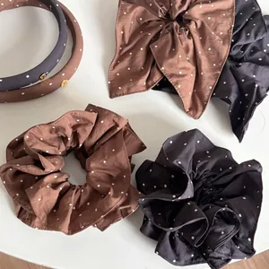 Polka dot hairband and bow scrunchie set in brown and grey fabric with gold accents