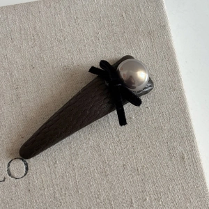 Elegant brown leather hair clip with black velvet bow and silver metallic bead