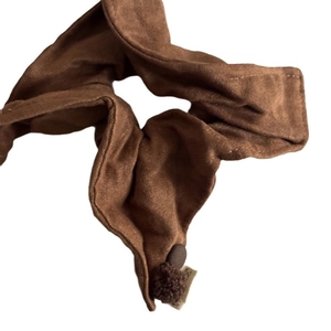 Elegant caramel brown velvet scrunchie with soft pom-pom details for autumn winter styling