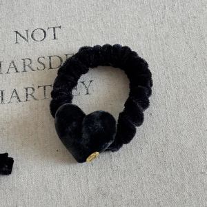 Elegant black velvet heart scrunchie with a gold 'Love' pendant for women