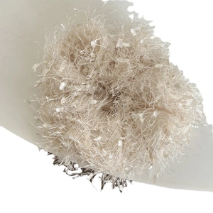 Fuzzy beige faux fur scrunchie for women with soft feathered texture on white background