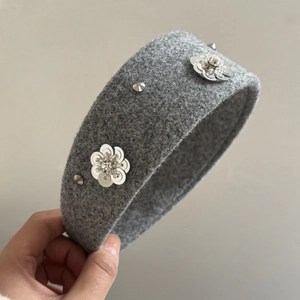 Grey felt headband with sequin flower and metallic rivet details for women