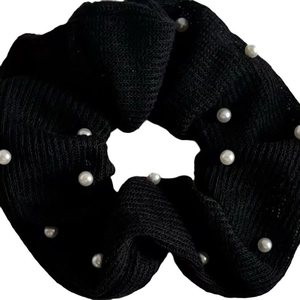 Classic black scrunchie with white pearls for elegant ponytail styling and Korean hair fashion