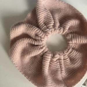 Pink knitted oversized scrunchie for women with detailed soft wool texture on white background