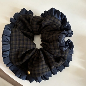 Retro plaid oversized scrunchie with navy blue ruffled edge and gold metallic detail