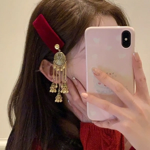 Vintage ethnic hair clip with red velvet base and long golden bell tassels for women