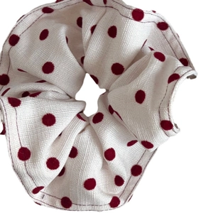 Vintage cream scrunchie with red polka dots for elegant low ponytail hairstyles