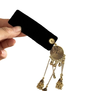 Vintage ethnic style velvet hair clip with bell tassels and retro bronze spiral motifs