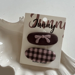 British school style pink plaid bow hair clips set on a white card tray