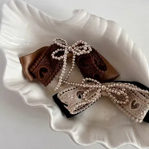 Lace and pearl bow hair clips set featuring elegant vintage brown and beige satin ribbon