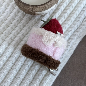 Cute plush strawberry cream cake hair clip for girls with a soft pink and white finish